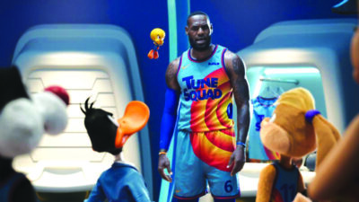 man in basketball uniform standing with cartoon characters
