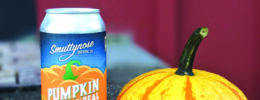 can of pumpkin ale sitting on counter beside small pumpkin