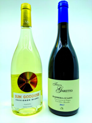 a bottle of red wine and a bottle of white win on gray background