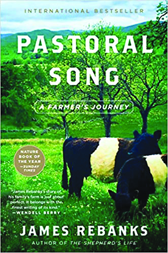 Book cover of Pastoral Song by James Rebanks, featuring a green field with trees and cows