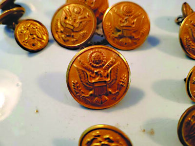 antique brass military buttons, featuring an eagle emblem stamped on