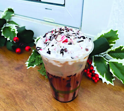 Peppermint mocha, with house blend A&E iced coffee, house made peppermint and mocha syrup, plant-based milk, coconut whipped cream and a cacao nib and candy cane topping