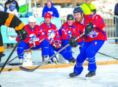 hockey players on outdoor skating rink