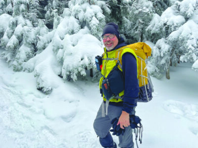 Hiking writer and gear expert Philip Werner stops for a break near Mount Garfield during a recent winter hike. Among his gear choices for this hike are softshell pants, single layer insulated gloves, a thin wool base layer shirt, high gaiters