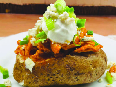 baked potato topped with buffalo chicken, Gorgonzola cheese, celery, sour cream and scallions