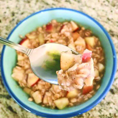 Spoon and bowl with overnight apple outmeal