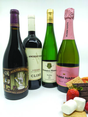 wine bottles with chocolate, graham crackers and strawberries