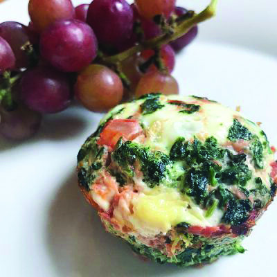 Spinach and salsa egg white muffins beside grapes