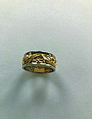 gold colored wedding band with decorative filigree around the band
