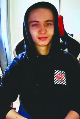 young man, smiling, in hoodie
