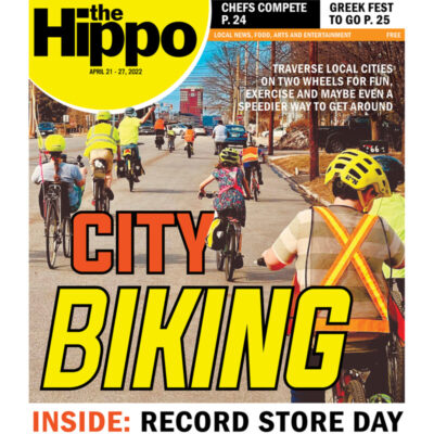 front page of the Hippo featuring biking in the city