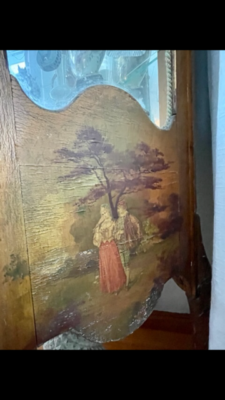 painting on wooden cabinet, showing pastoral scene