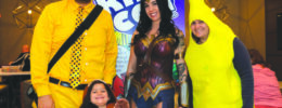 family in costumes for kids comic book convention