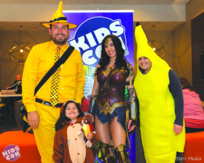 family in costumes for kids comic book convention