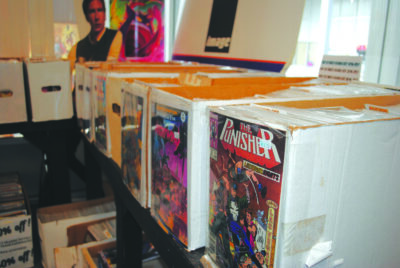 boxes of comic books on table in store