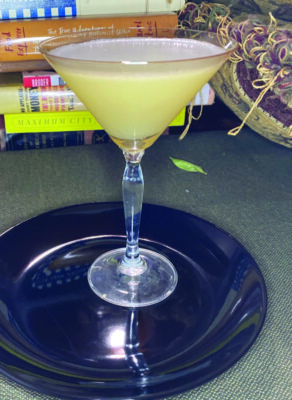 martini glass on plate on counter
