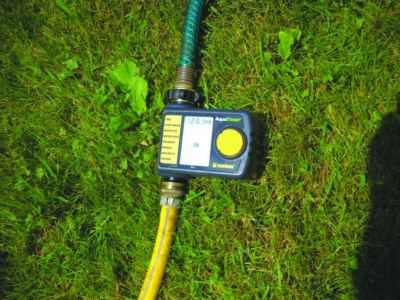 a watering timer hooked up to 2 hoses