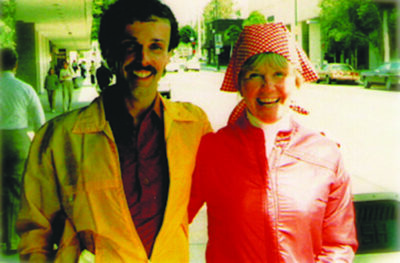 Paul Brogan standing on sidewalk with Doris Day in old photograph