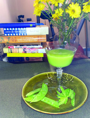 green cocktail on plate with peas