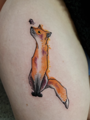 tattoo of a fox looking at a butterfly at the tip of their nose