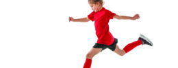young girl running with soccer ball on blank background