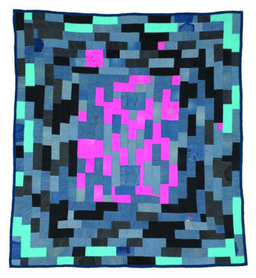 quilt with pattern of small rectangles contrasting in light and dark colors