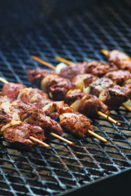 kebabs lined up on grill
