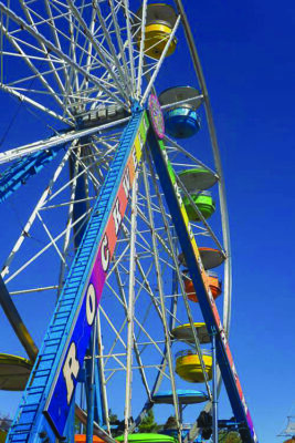 colorful ferris wheel seen from below