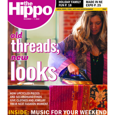 Cover of the Hippo, featuring a woman ironing cloth in her studio
