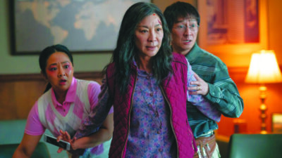 Michelle Yeoh and costars in scene from Everything Everywhere all at once