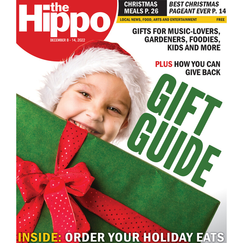 Cover of the Hippo, Gift Guide, photo of boy holding wrapped present