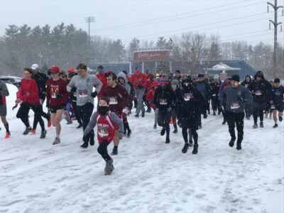 lots of people starting a race in the snow