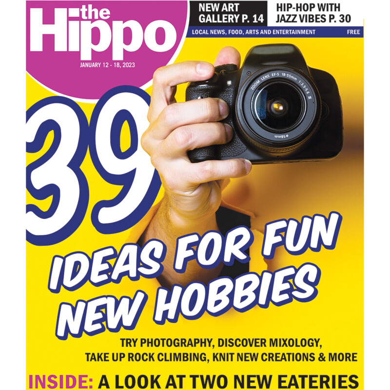 publication cover showing hand holding camera, text 39 ideas for fun new hobbies