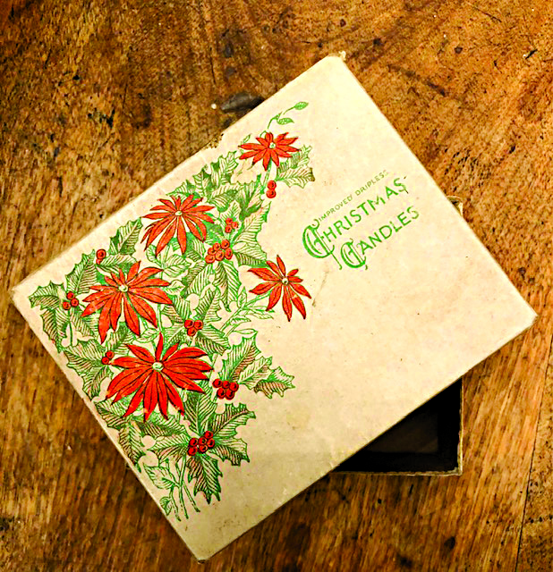 vintage box decorated with christmas flower design and words christmas candles
