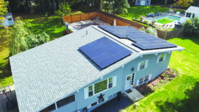 one story house seen from above with solar panels on the house