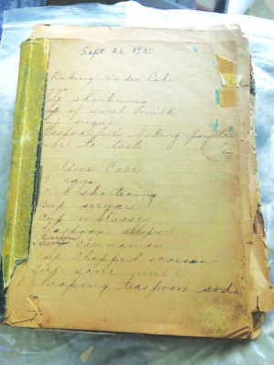 old worn stack of papers with handwritten cursive recipes in faded ink