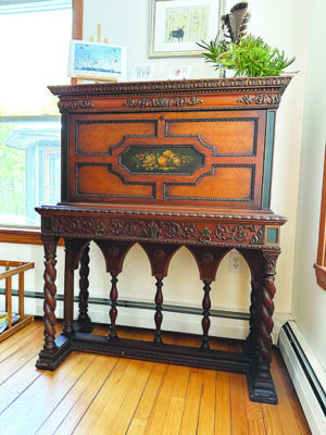 tall task with cabinet, decorative wood carvings