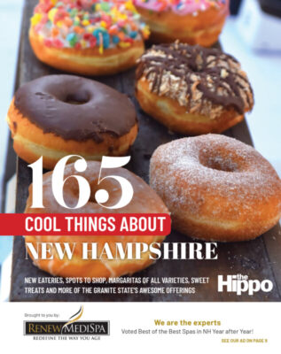 cover of Hippo best of magazine featuring wooden table with 2 rows of doughnuts, in focus foreground with doughnuts blurring into background