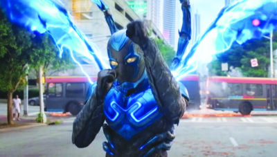 screenshot from Blue Beetle movie showing character in super hero beetle costume with wings
