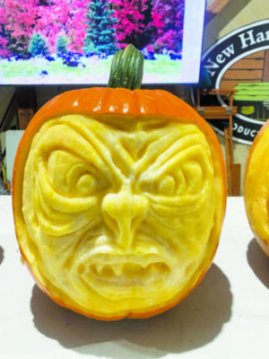 pumpkin carved into snarling face