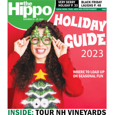cover of Hippo Holiday Guide 2023 showing woman wearing ugly christmas sweater and funny glasses with christmas trees on top