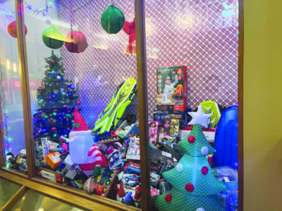 Holiday window display with toys inside