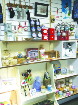 shelves of handcrafted christmas ornaments and little gifts