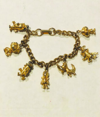 chain link bracelet with small metal charms shaped as Wizard of Oz characters