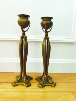 2 metal candlesticks made of smooth organic shapes