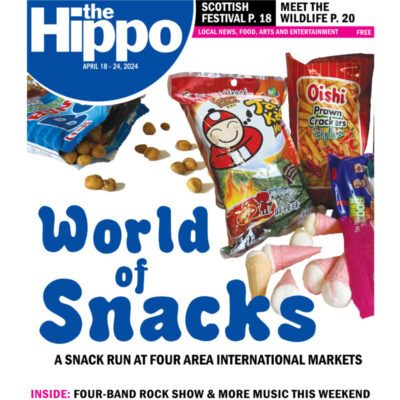 cover for World of snacks showing plastic backs of snacks with food spilling out