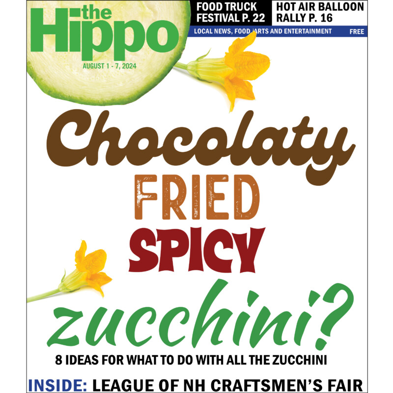 The Hippo frontpage with words chocolaty fried spicy zucchini on white background, 2 zucchini flowers beside text