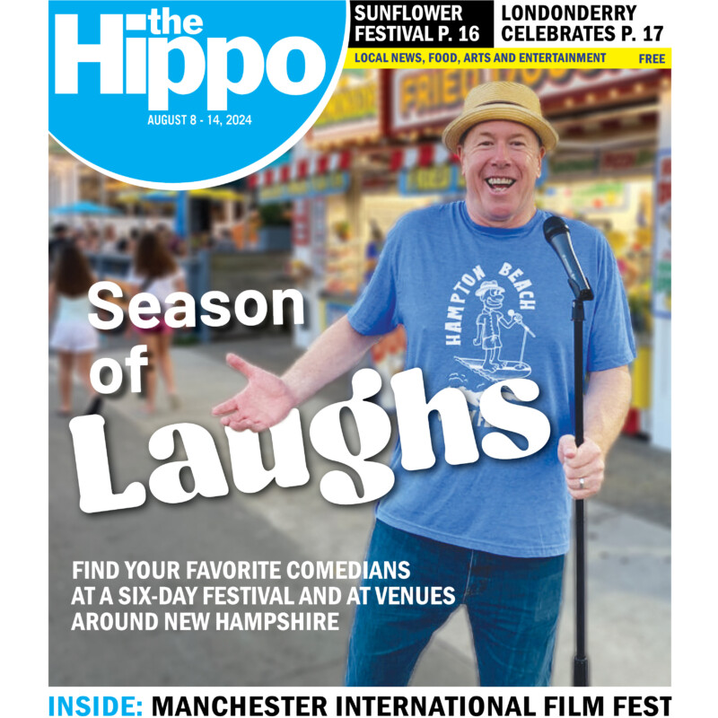 frontpage of the Hippo with comedian Jimmy Dunn standing on sidewalk with standing microphone