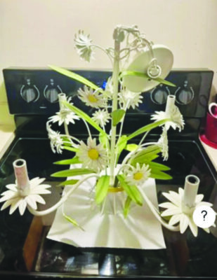 chandelier with petal shaped light fixtures and flowers and leaves decorating center