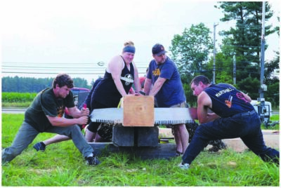 Two Lumberjacks competing and cutting a log of wood